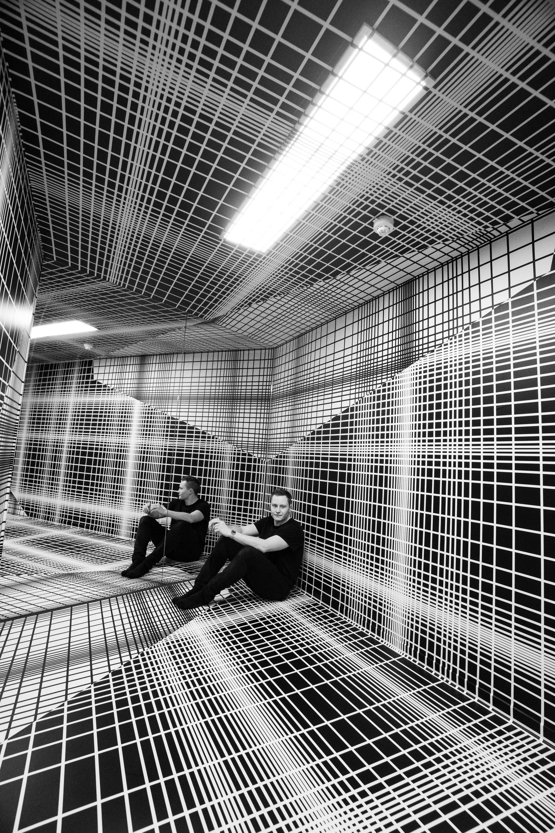 Illuseum Grid Room — immersive black and white grid room